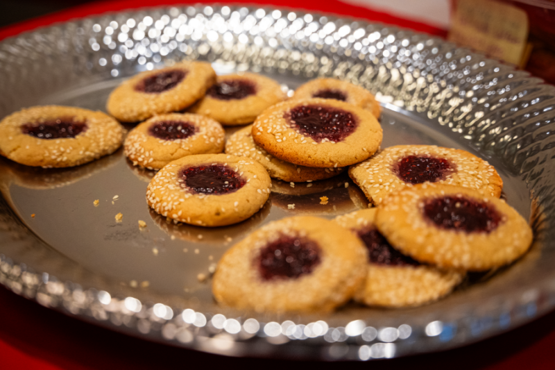 Cookies with red jelly in the middle.