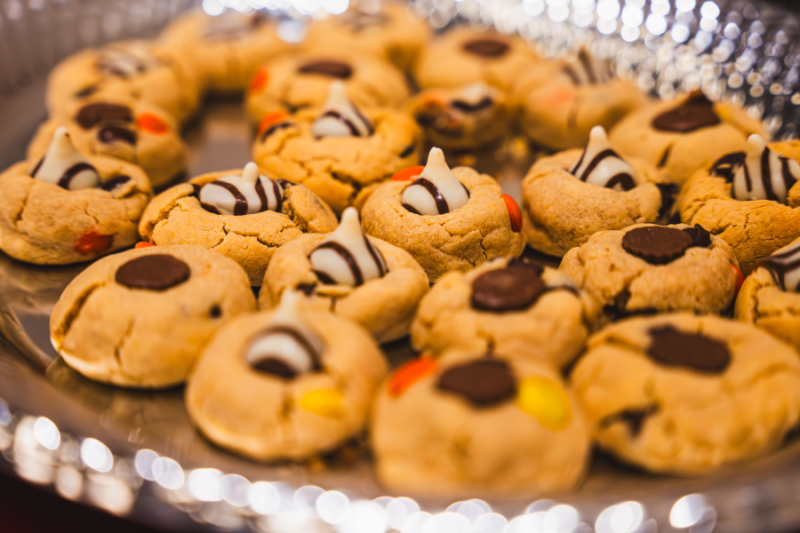 Peanut butter cookies with black and white chocolates in the center.