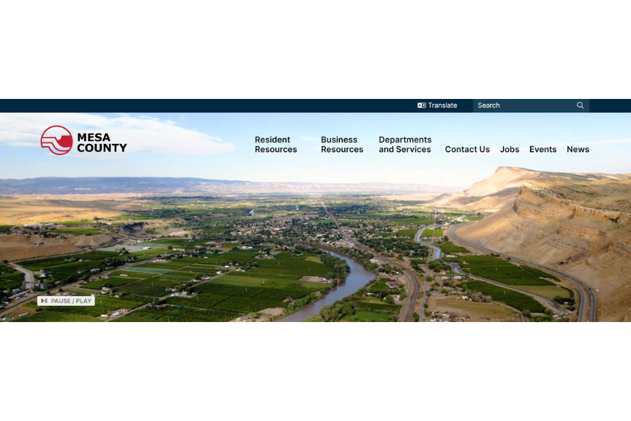 Front page of new Mesa County website showing aerial view image of Mesa County, the Mesa County logo, and tabs including Resident Resources, Business Resources, Departments and Services, Contact Us, Jobs, Events, and News.