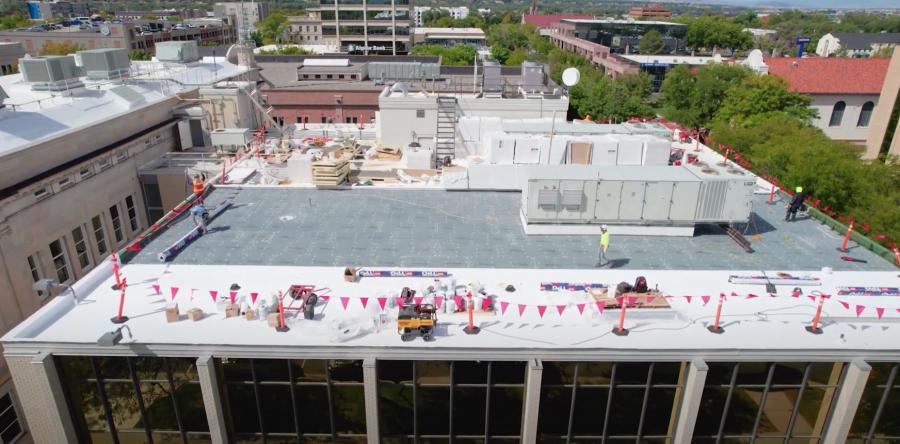 Aerial view of Mesa County Old Courthouse roof with red caution flags.