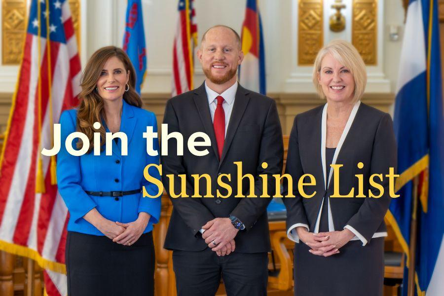 Board of Mesa County Commissioners smiling with white and yellow text reading "Join the Sunshine List."