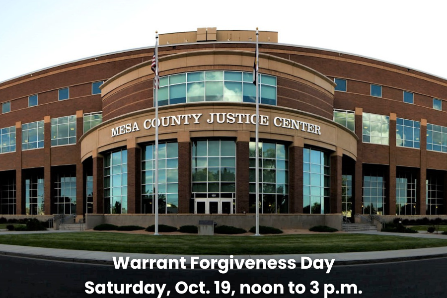 Mesa County Justice Center building with text promoting Warrant Forgiveness Day, Saturday, October 19, noon to 3 p.m.